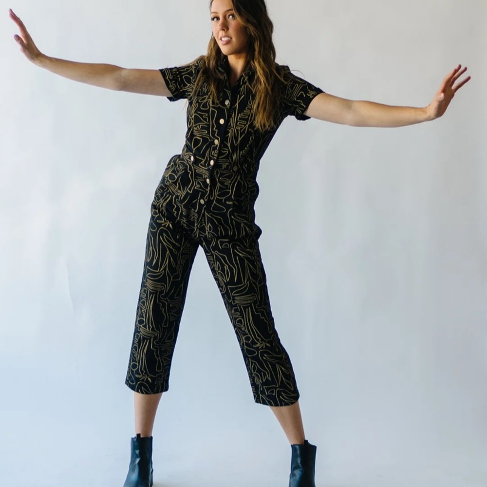 Button up romper with a modern and minimal print.